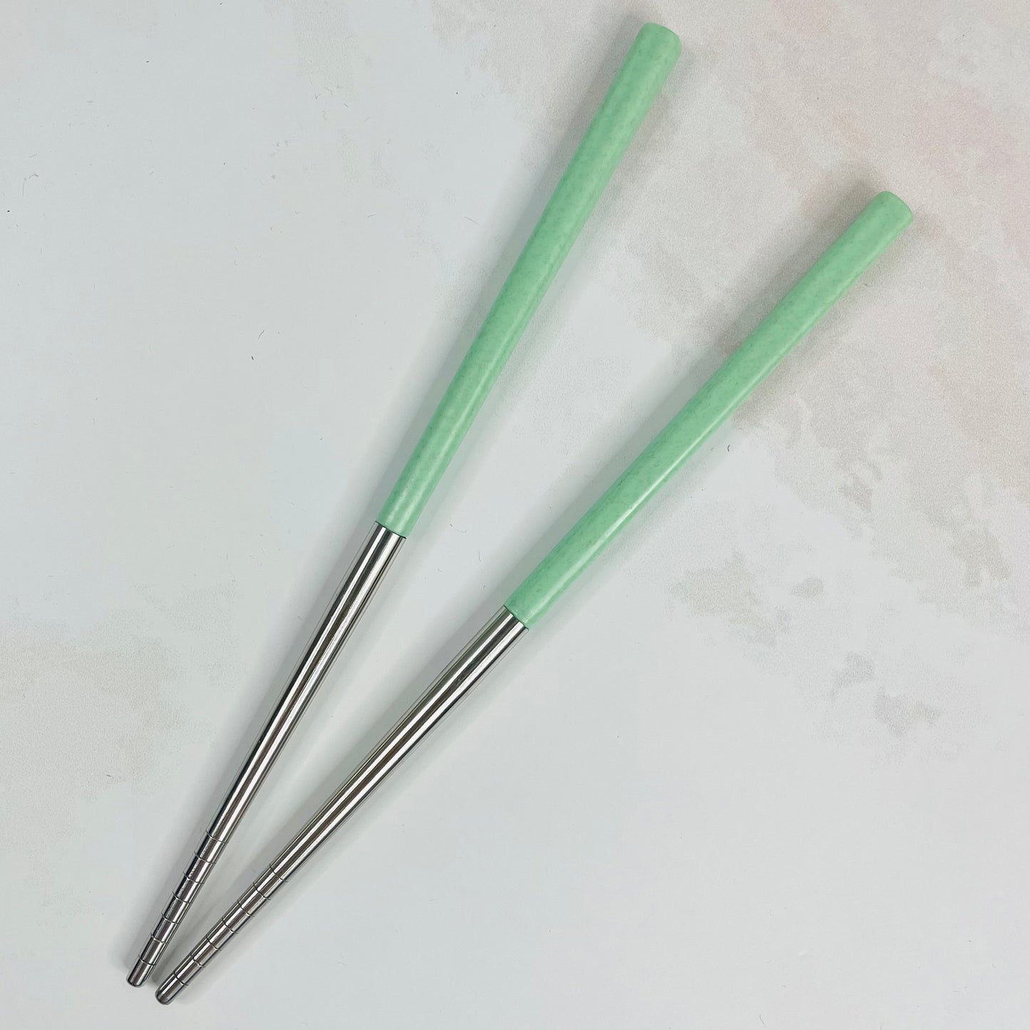 Par de palillos verde&plateado