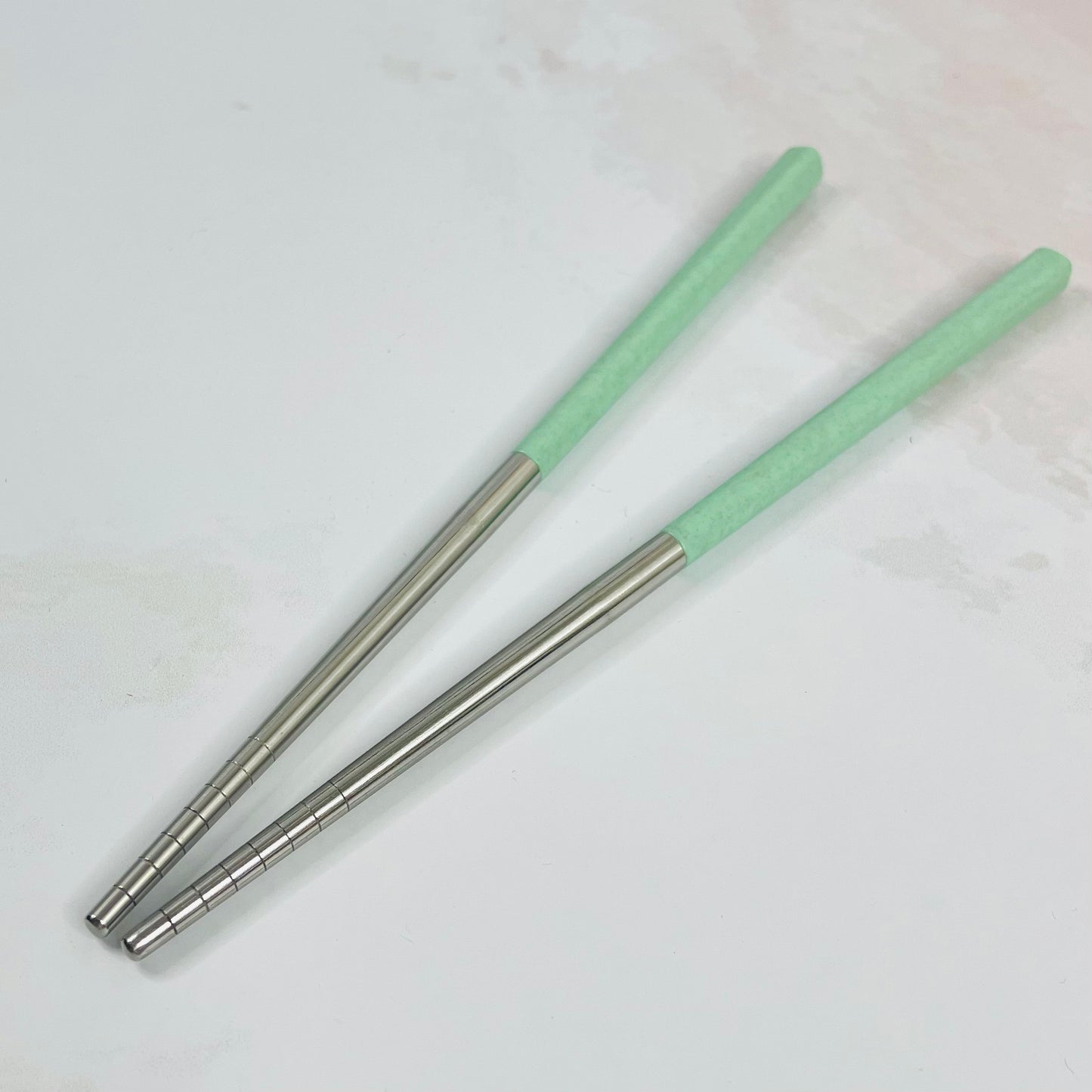 Par de palillos verde&plateado
